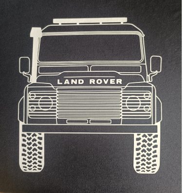 T-Shirt Land Rover Defender Front Frontansicht eines Land Rover mit markantem Grill und Reifenprofil.